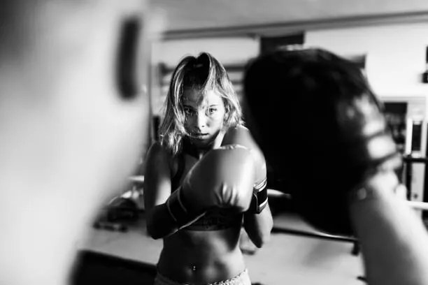 Φωτογραφία Woman boxer workout with coach, massimo colombo