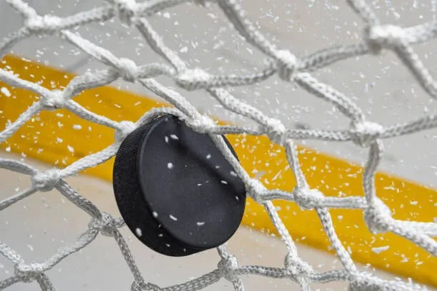 Φωτογραφία Close-up of an Ice Hockey puck, cmannphoto