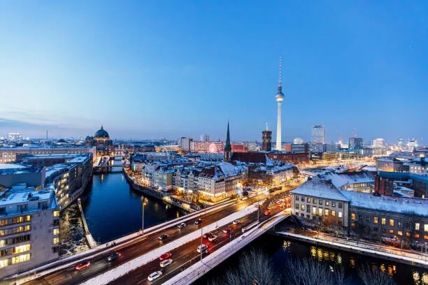 Φωτογραφία Aerial view of Berlin illuminated skyline, Alexander Spatari