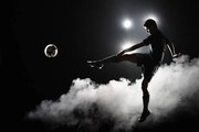 Φωτογραφία Soccer player kicking the ball at night on stadium, Stanislaw Pytel