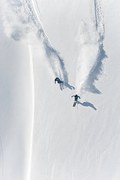 Φωτογραφία Aerial view of two skiers skiing, Creativaimage