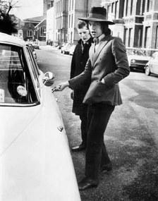 Φωτογραφία Jagger, singer with the Rolling Stones, about to get into his car, c.1970