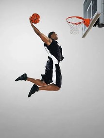 Φωτογραφία Basketball player dunking ball, low angle view, Blake Little